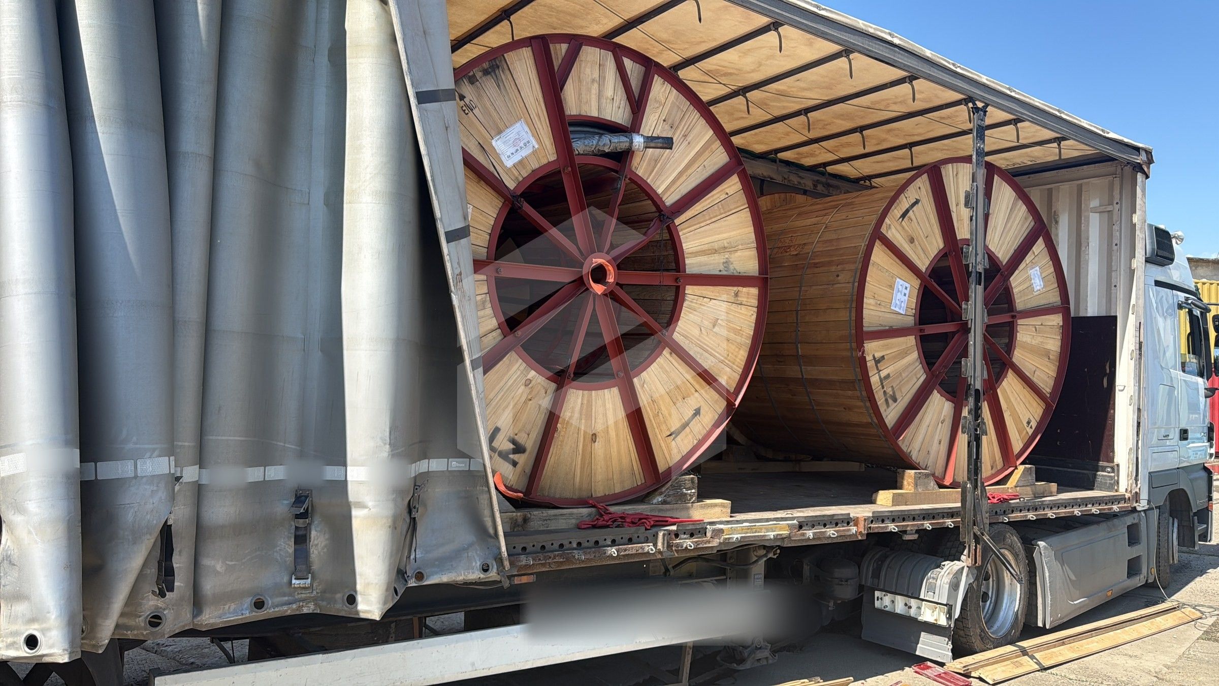 Cable drums in a tautliner with the curtain open